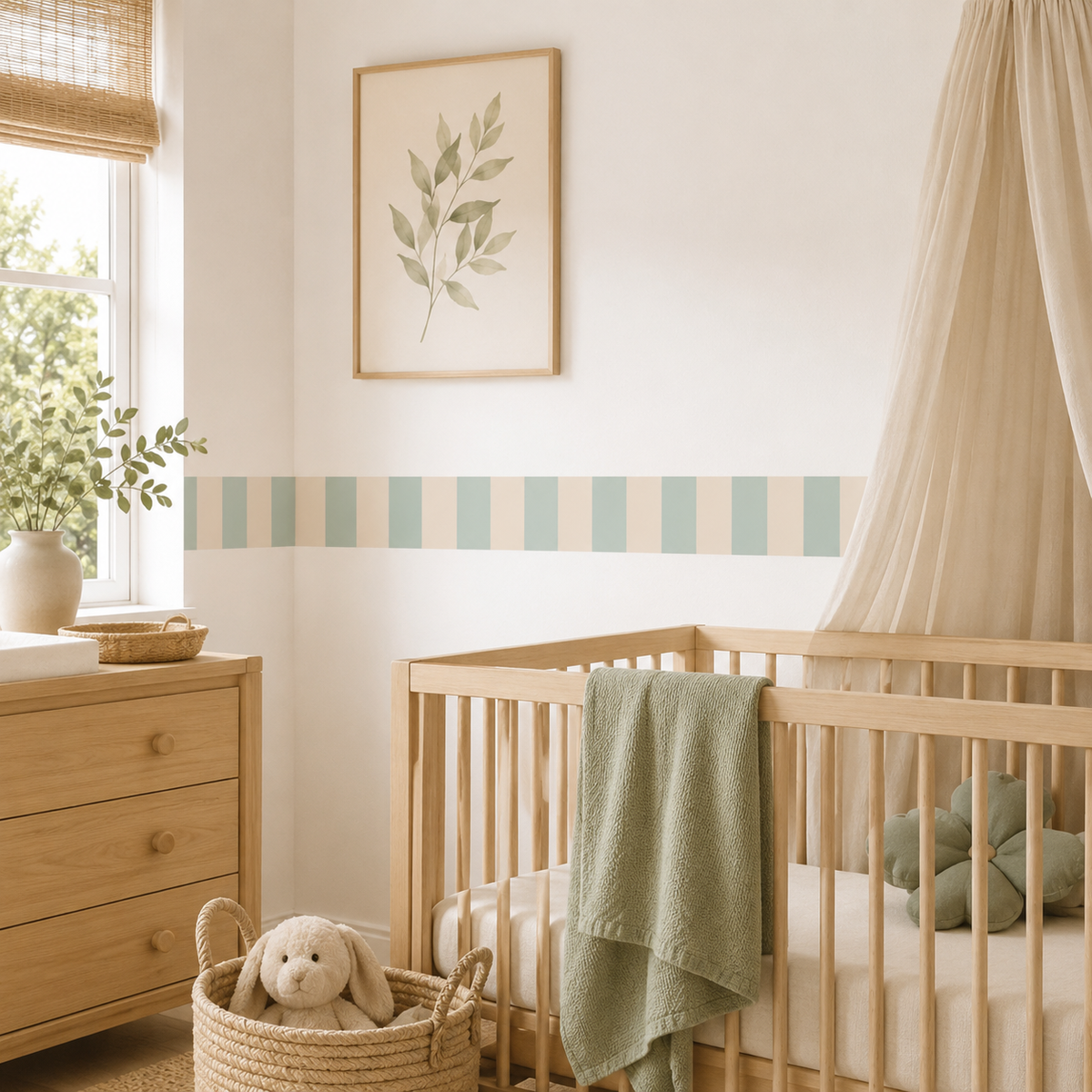 Mint and almond striped fabric wallpaper border above a wooden crib with a green blanket and beige canopy in a nursery.