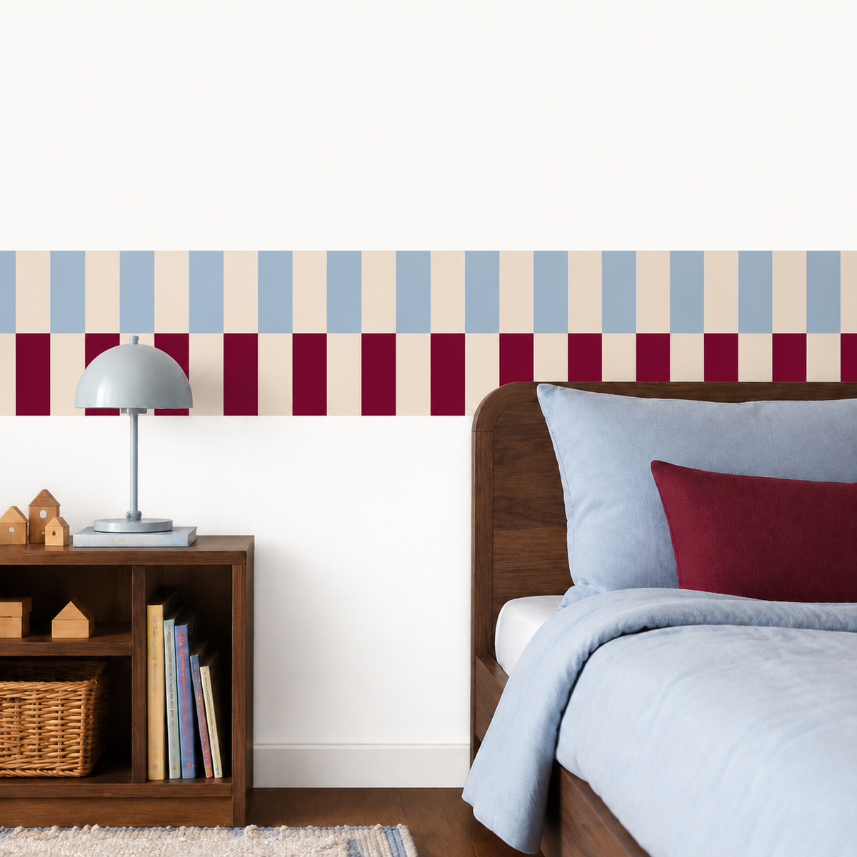 Peel-and-stick checkerboard wallpaper border in powder blue and burgundy, styled above a bed in a modern kids’ bedroom.