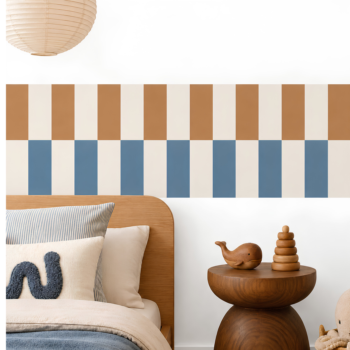 Peel-and-stick checkerboard wallpaper border in tan and dusty blue, styled above a wooden bed in a modern kids’ bedroom.