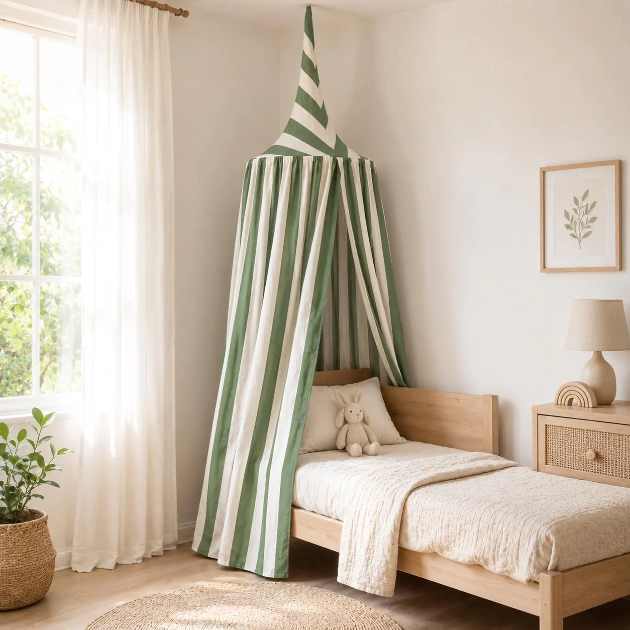 Magical white kids bed canopy hanging gracefully over a cozy wooden toddler bed in a modern nursery.