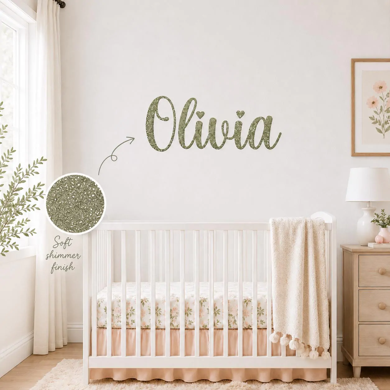 A stylish personalized name wall decal applied beautifully to a nursery wall above a wooden crib.